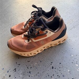 On Running Brown and Tan Athletic Shoes